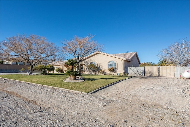 10140 W Tropical Pkwy, Las Vegas, NV 89149 - view of front of home featuring a gate, stucco siding, driveway, and a tiled roof