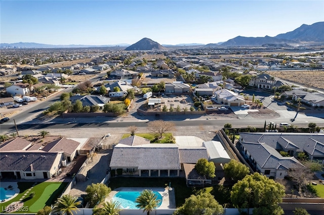 10140 W Tropical Pkwy, Las Vegas, NV 89149 - aerial perspective of suburban area with a mountain backdrop and a pool