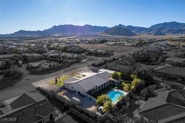 10140 W Tropical Pkwy, Las Vegas, NV 89149 - aerial perspective of suburban area featuring a mountain backdrop and a pool area