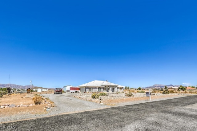 1410 Tiptop Trl, Pahrump, NV 89048 - view of front of property with a mountain view and driveway