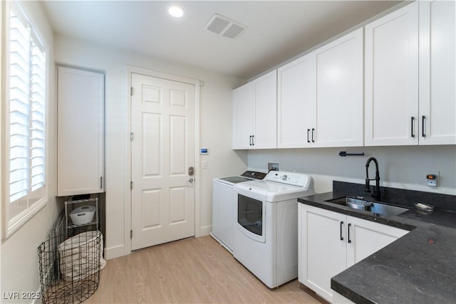 10002 Trapper Mountain St, Las Vegas, NV 89178 - clothes washing area with independent washer and dryer, cabinet space, light wood-style flooring, and recessed lighting