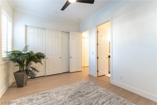 10002 Trapper Mountain St, Las Vegas, NV 89178 - bedroom with ornamental molding, multiple windows, wood finished floors, and a closet