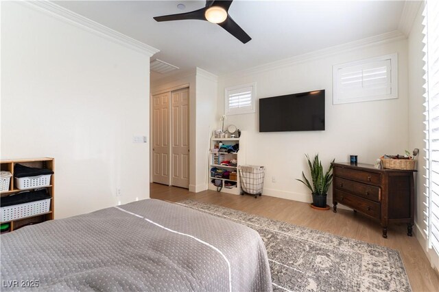 10002 Trapper Mountain St, Las Vegas, NV 89178 - bedroom with ornamental molding, wood finished floors, multiple windows, and a ceiling fan