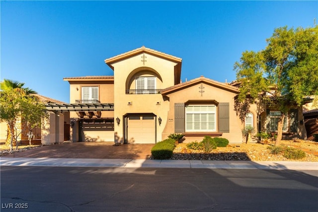 10002 Trapper Mountain St, Las Vegas, NV 89178 - mediterranean / spanish-style home featuring a balcony, a garage, stucco siding, driveway, and a tile roof