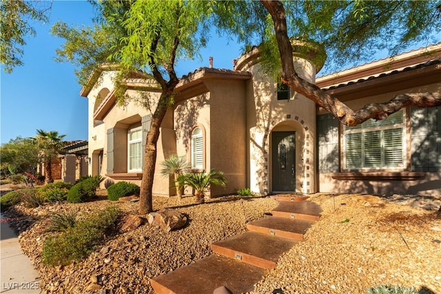 10002 Trapper Mountain St, Las Vegas, NV 89178 - mediterranean / spanish home featuring stucco siding and a tiled roof
