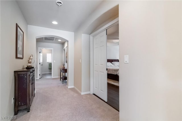 8275 Old Creek Ranch St, Las Vegas, NV 89139 - corridor featuring arched walkways, light carpet, recessed lighting, and baseboards