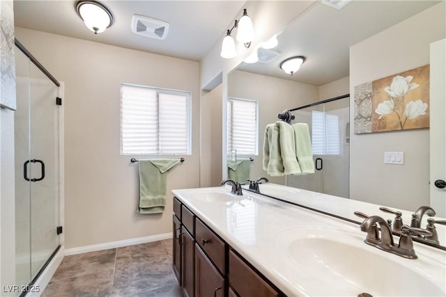 8275 Old Creek Ranch St, Las Vegas, NV 89139 - bathroom with a stall shower, double vanity, and baseboards