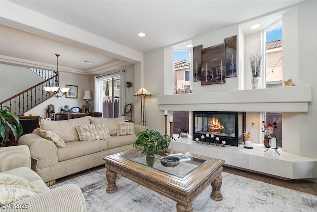 8275 Old Creek Ranch St, Las Vegas, NV 89139 - living area featuring stairway, a chandelier, recessed lighting, and a fireplace