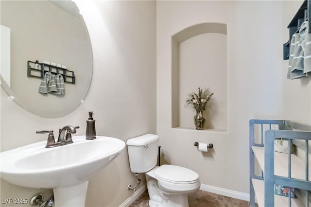 8275 Old Creek Ranch St, Las Vegas, NV 89139 - bathroom featuring baseboards, toilet, and a sink