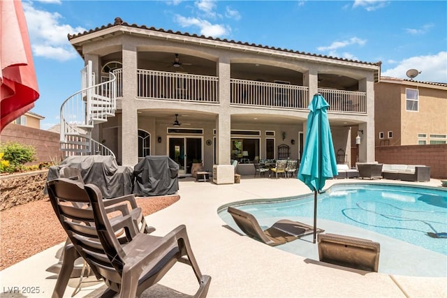 8275 Old Creek Ranch St, Las Vegas, NV 89139 - back of property featuring a balcony, a ceiling fan, an outdoor hangout area, stairs, and a patio