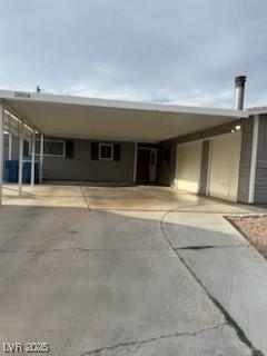 5804 Balzar Ave, Las Vegas, NV 89108 - manufactured / mobile home with an attached carport and driveway