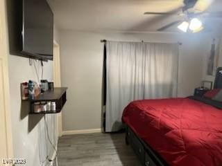 5804 Balzar Ave, Las Vegas, NV 89108 - bedroom with baseboards, wood finished floors, and a ceiling fan