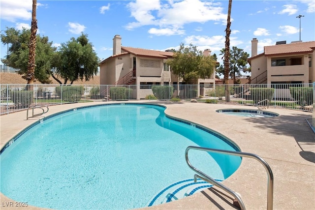 829 Rock Springs Dr Unit 201, Las Vegas, NV 89128 - community pool with a community hot tub, fence, and a patio area