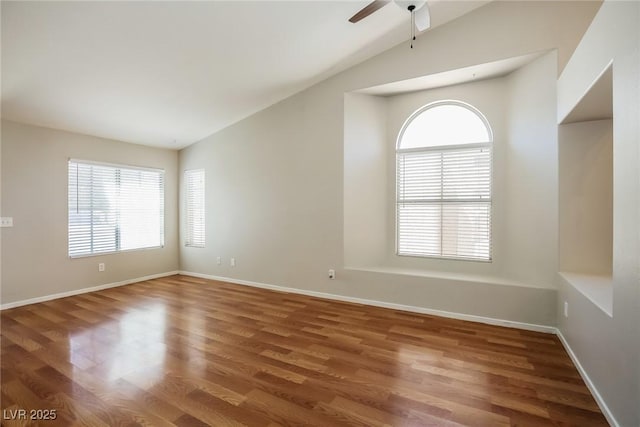 3416 Steppe St, North Las Vegas, NV 89032 - spare room featuring healthy amount of natural light, vaulted ceiling, wood finished floors, ceiling fan, and baseboards
