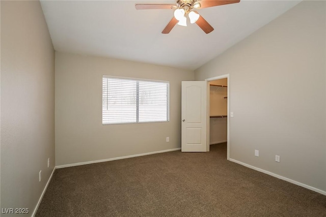 3416 Steppe St, North Las Vegas, NV 89032 - empty room featuring dark carpet, a ceiling fan, baseboards, and vaulted ceiling
