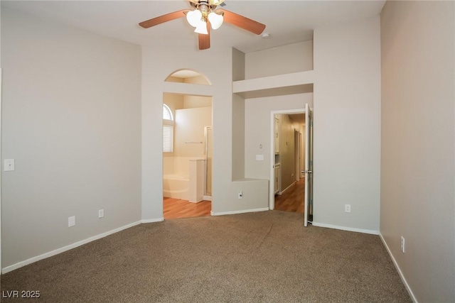3416 Steppe St, North Las Vegas, NV 89032 - unfurnished bedroom with carpet floors, baseboards, ensuite bath, and ceiling fan