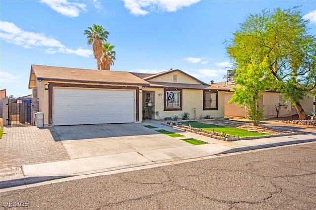 251 Las Palmaritas Dr, Las Vegas, NV 89110 - ranch-style home featuring concrete driveway, a garage, stucco siding, and a gate
