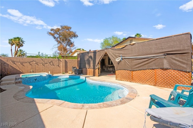 251 Las Palmaritas Dr, Las Vegas, NV 89110 - view of swimming pool featuring a fenced backyard, a patio, and a pool with connected hot tub