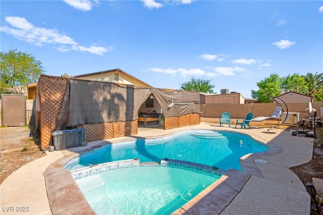 251 Las Palmaritas Dr, Las Vegas, NV 89110 - view of swimming pool featuring a fenced backyard, a pool with connected hot tub, and a patio area