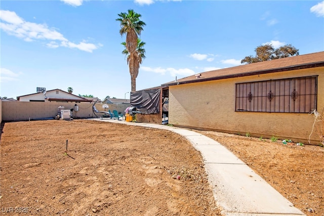 251 Las Palmaritas Dr, Las Vegas, NV 89110 - fenced backyard with a patio