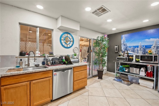 251 Las Palmaritas Dr, Las Vegas, NV 89110 - kitchen with appliances with stainless steel finishes, a sink, recessed lighting, light stone countertops, and light tile patterned flooring