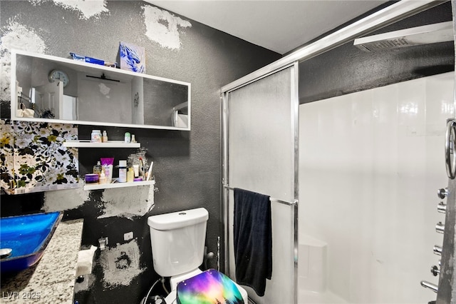 251 Las Palmaritas Dr, Las Vegas, NV 89110 - full bath featuring a textured wall, a stall shower, and toilet