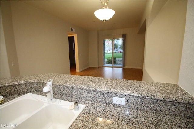 62 E Serene Ave Unit 129, Las Vegas, NV 89123 - interior space featuring a sink and wood finished floors
