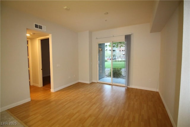 62 E Serene Ave Unit 129, Las Vegas, NV 89123 - empty room featuring light wood-style flooring and baseboards