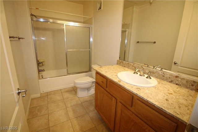62 E Serene Ave Unit 129, Las Vegas, NV 89123 - bathroom with tile patterned floors, toilet, vanity, and enclosed tub / shower combo