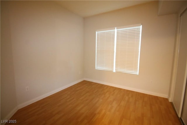 62 E Serene Ave Unit 129, Las Vegas, NV 89123 - spare room with wood finished floors and baseboards