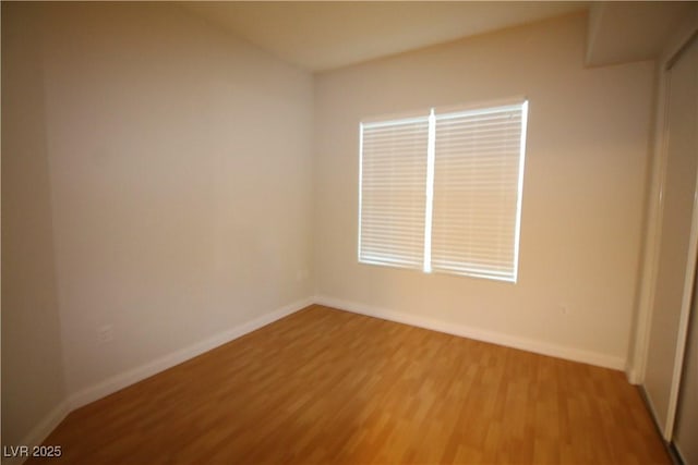 62 E Serene Ave Unit 129, Las Vegas, NV 89123 - spare room featuring light wood-style floors and baseboards