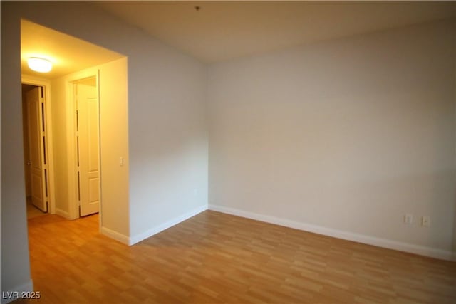62 E Serene Ave Unit 129, Las Vegas, NV 89123 - empty room featuring light wood-type flooring and baseboards
