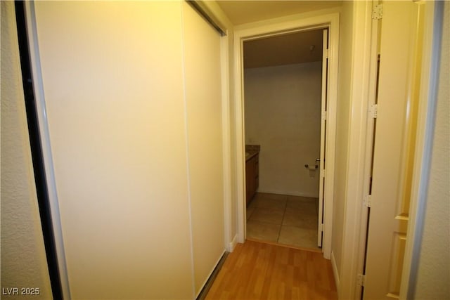 62 E Serene Ave Unit 129, Las Vegas, NV 89123 - hallway featuring light wood-type flooring