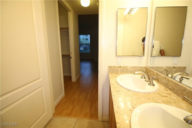 62 E Serene Ave Unit 129, Las Vegas, NV 89123 - bathroom with double vanity, tile patterned floors, and baseboards