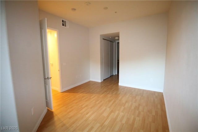 62 E Serene Ave Unit 129, Las Vegas, NV 89123 - empty room featuring light wood-style flooring and baseboards