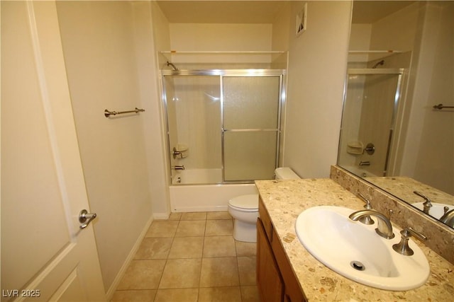 62 E Serene Ave Unit 129, Las Vegas, NV 89123 - full bath with toilet, vanity, tile patterned flooring, enclosed tub / shower combo, and baseboards