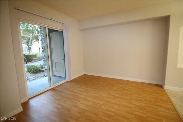 62 E Serene Ave Unit 129, Las Vegas, NV 89123 - spare room featuring light wood finished floors and baseboards