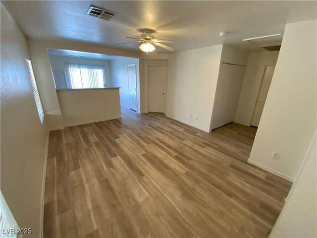 5474 Jacobs Field St, Las Vegas, NV 89148 - spare room featuring ceiling fan, wood finished floors, and baseboards