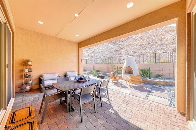 125 Mirage View Dr, Henderson, NV 89011 - view of patio / terrace featuring an outdoor fireplace, a fenced backyard, and outdoor dining area