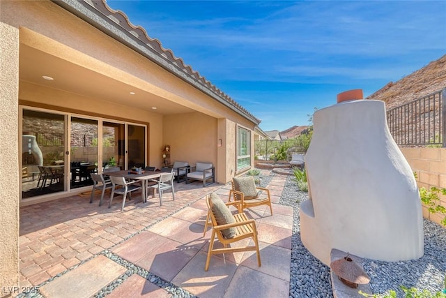 125 Mirage View Dr, Henderson, NV 89011 - view of patio featuring fence and outdoor dining space