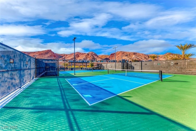125 Mirage View Dr, Henderson, NV 89011 - view of tennis court featuring fence and a mountain view