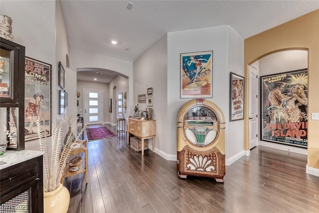 125 Mirage View Dr, Henderson, NV 89011 - entryway with arched walkways, dark wood finished floors, and baseboards