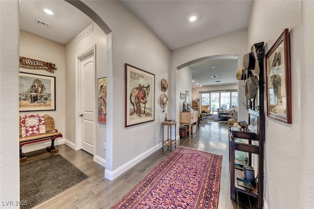 125 Mirage View Dr, Henderson, NV 89011 - hall featuring arched walkways, wood finished floors, baseboards, and recessed lighting
