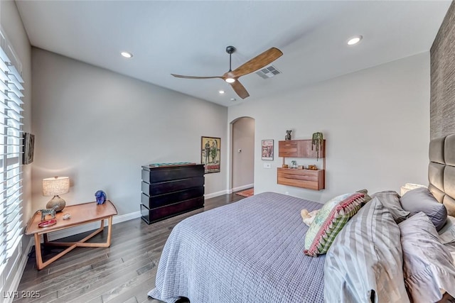 125 Mirage View Dr, Henderson, NV 89011 - bedroom featuring arched walkways, wood finished floors, recessed lighting, ceiling fan, and baseboards