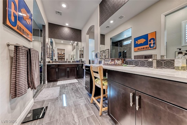 125 Mirage View Dr, Henderson, NV 89011 - full bathroom with a stall shower, recessed lighting, and two vanities