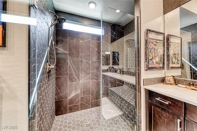 125 Mirage View Dr, Henderson, NV 89011 - full bath featuring a walk in shower, vanity, and a textured ceiling