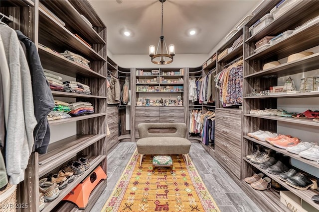 125 Mirage View Dr, Henderson, NV 89011 - walk in closet featuring a chandelier and wood finished floors