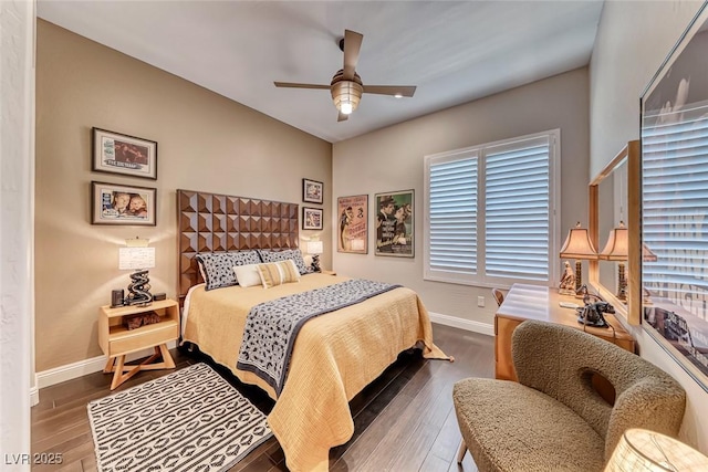 125 Mirage View Dr, Henderson, NV 89011 - bedroom with wood finished floors, baseboards, a ceiling fan, and multiple windows