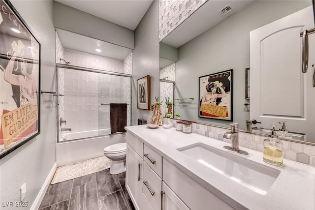 125 Mirage View Dr, Henderson, NV 89011 - bathroom featuring toilet, vanity, shower / bath combination with glass door, and baseboards