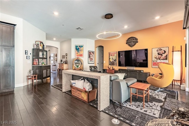 125 Mirage View Dr, Henderson, NV 89011 - living room with arched walkways, dark wood-style flooring, baseboards, and recessed lighting